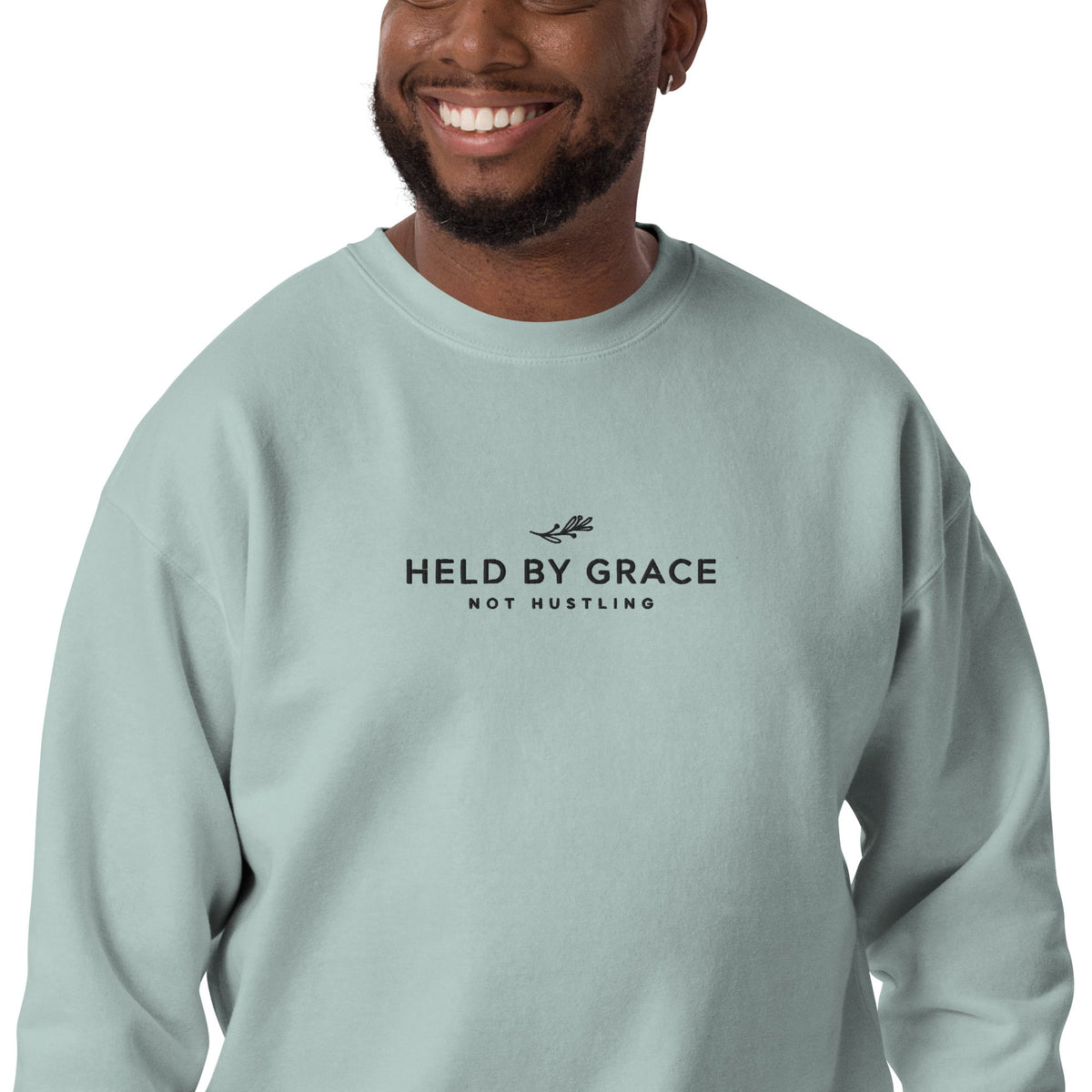 Held by Grace, Not Hustling embroidered premium sweatshirt in Agave, product view